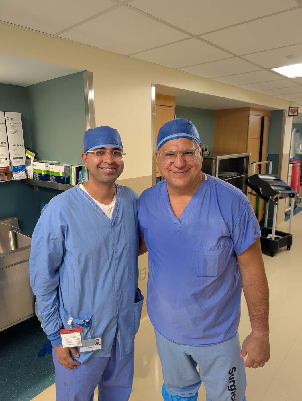 Dr Aditya Malik in theatre scrubs with Professor Joaquin Sanchez-Sotelo at the Mayo Clinic